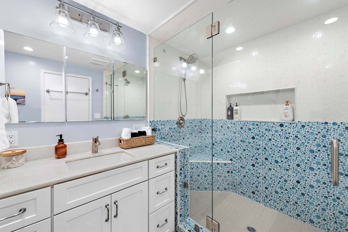 The master bath is large and comfortable with plenty of storage for you things but also fluffy towels.  The shower is large enough for two and even has two shower heads :)