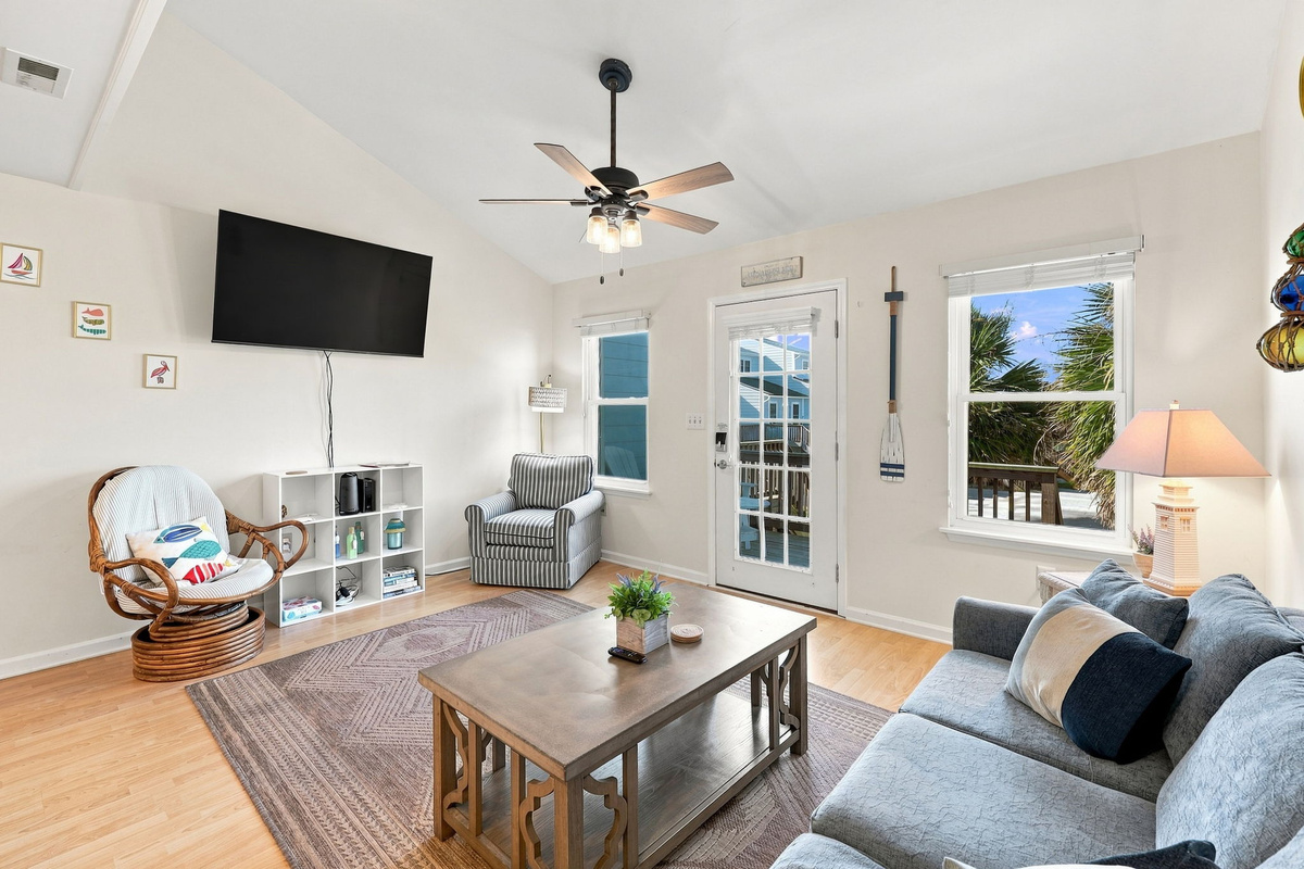 Kick back and relax in the bright, open living space after a fun-filled day at the beach.