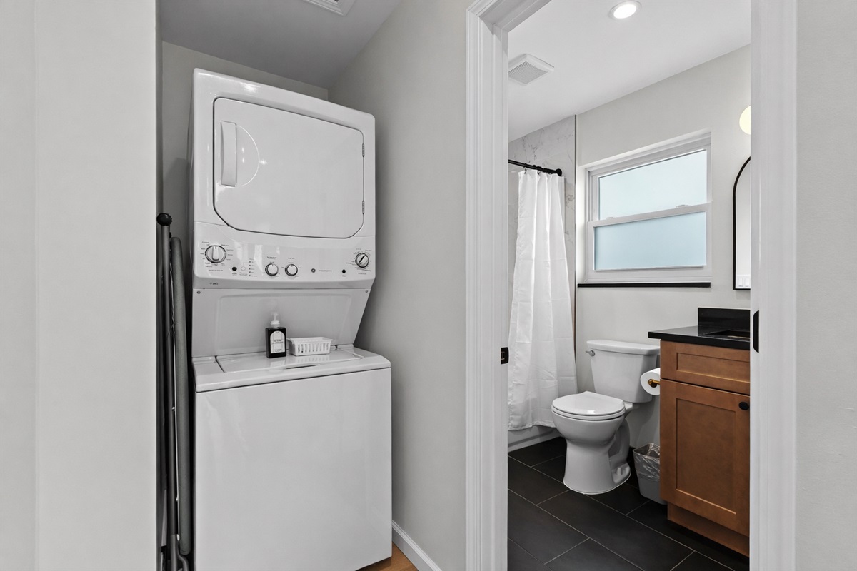 Convenient in-unit laundry with washer and dryer, plus a clean, modern bathroom—everything you need for a comfortable, hassle-free stay.