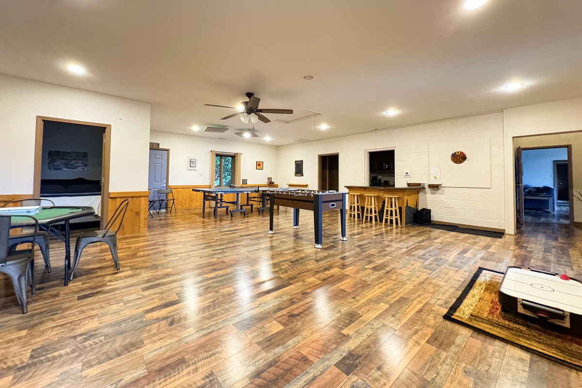 Our game room features foosball, ping pong table, ring toss, card table, kids's air hockey(floor model), Smart TV, kitchenette, bathroom, sauna, and more.