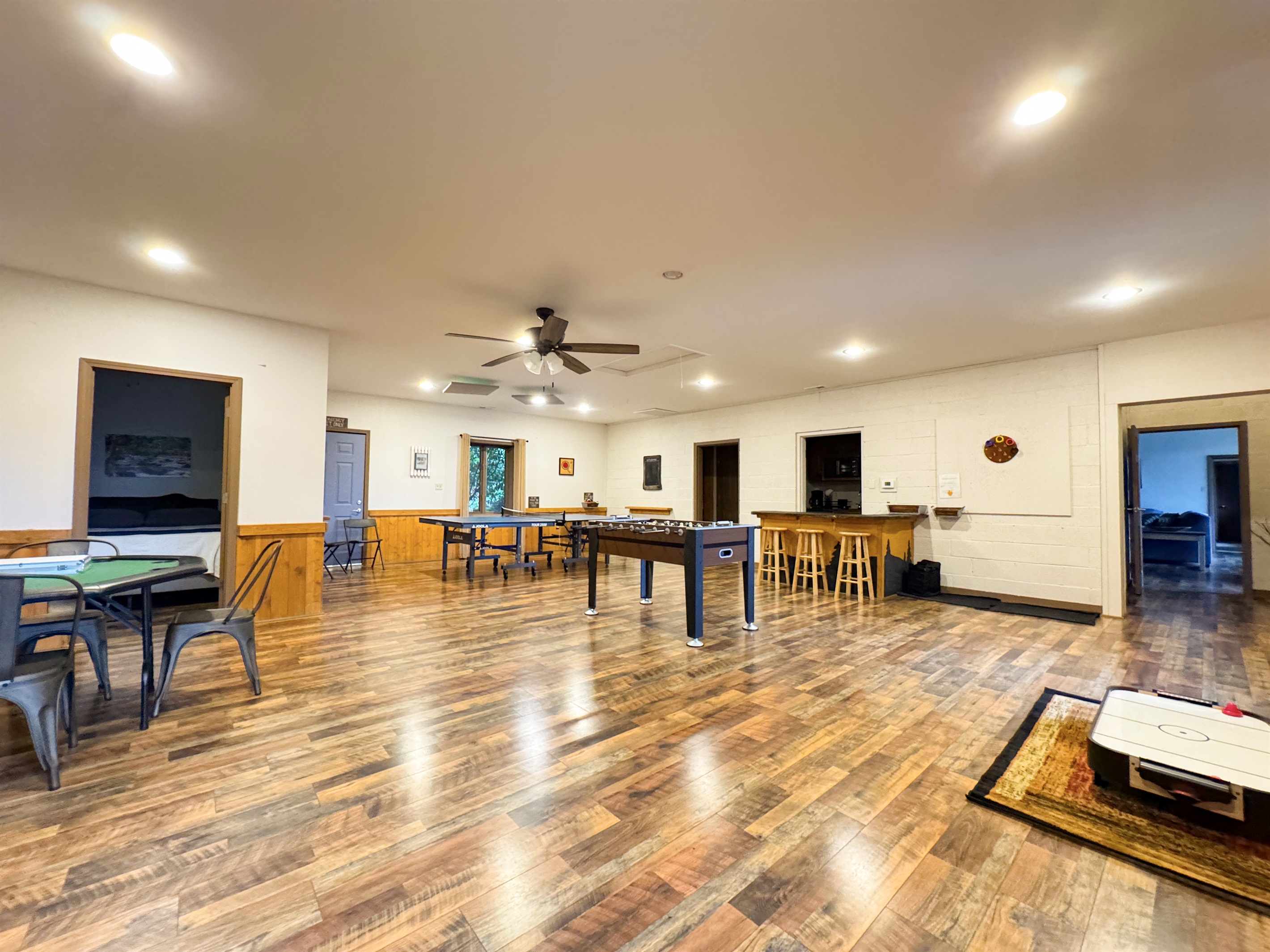 Our game room features foosball, ping pong table, ring toss, card table, kids's air hockey(floor model), Smart TV, kitchenette, bathroom, sauna, and more.