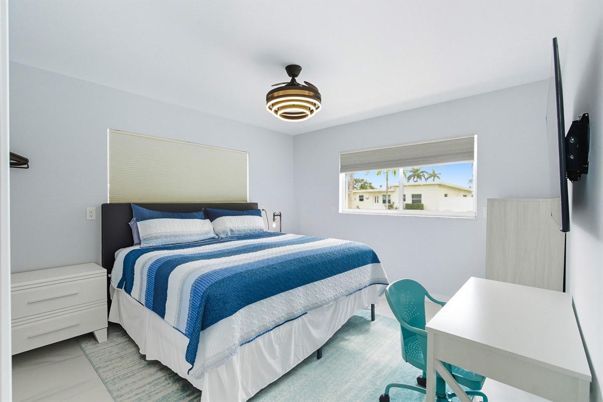 Bedroom 3 on the ground floor offers a king bed, smart TV and en suite bathroom.