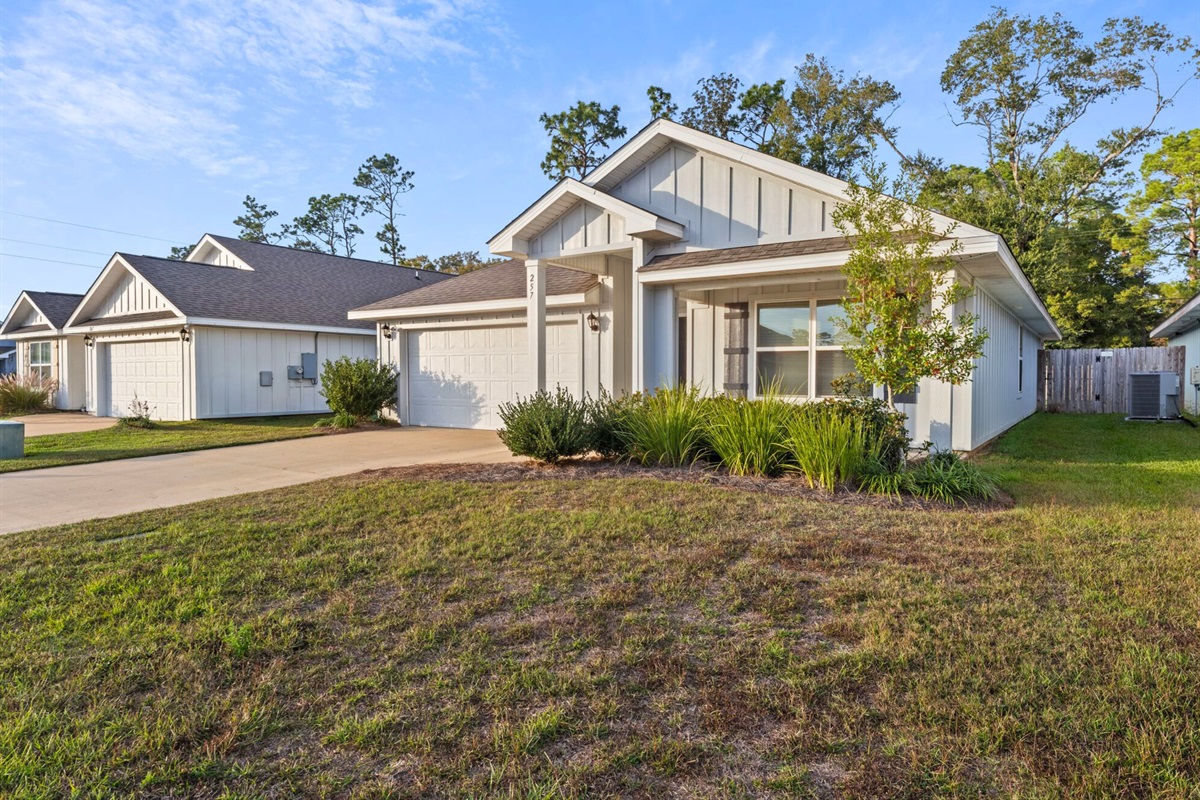 A front view of the home shows its peaceful neighborhood setting, offering a calm place to return to after busy days out.