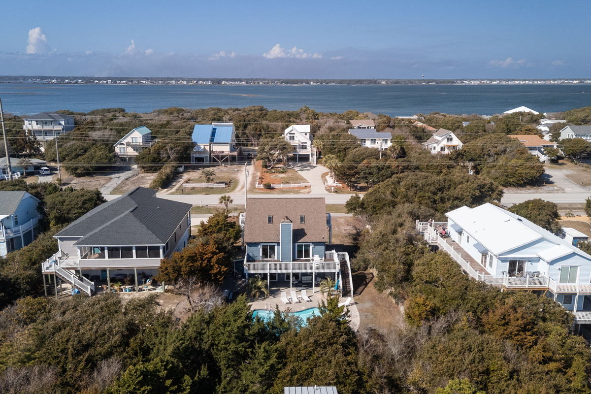 Elevated aerial view of our home and neighborhood, with scenic views toward the sound