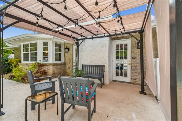 The covered, lighted pergola by the pool.