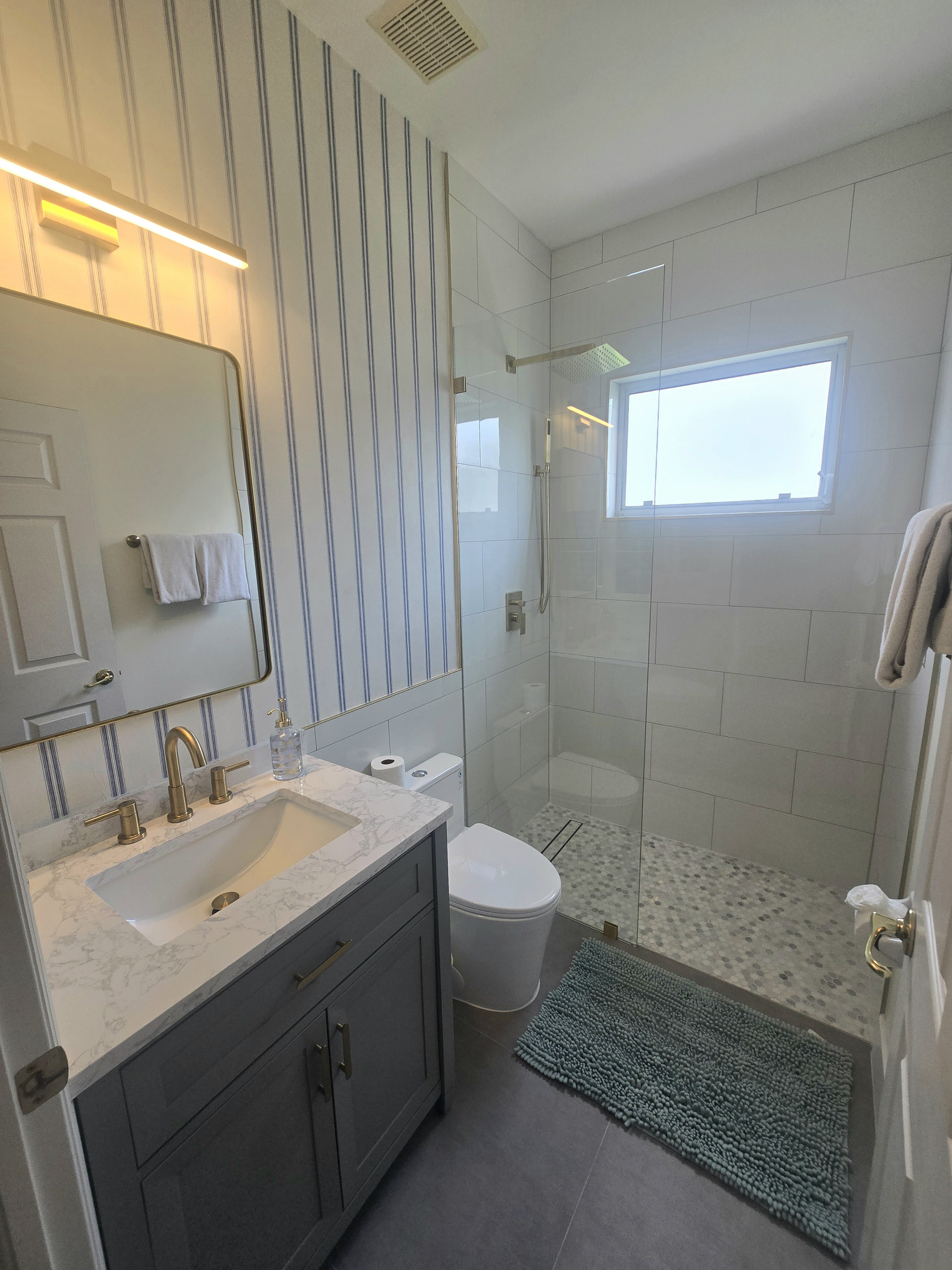 2nd guest bathroom with a modern shower