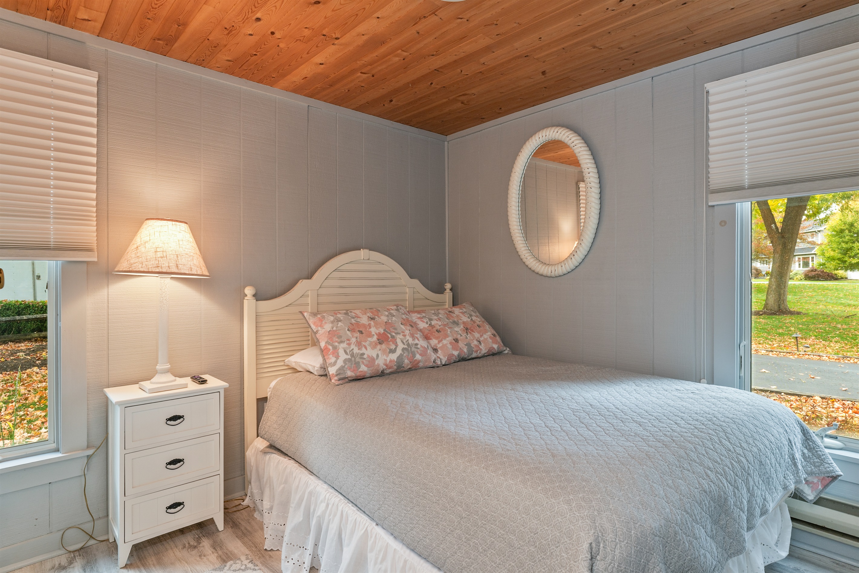 Cozy guest bedroom with vintage charm and soft lighting — perfect for a peaceful night’s rest.