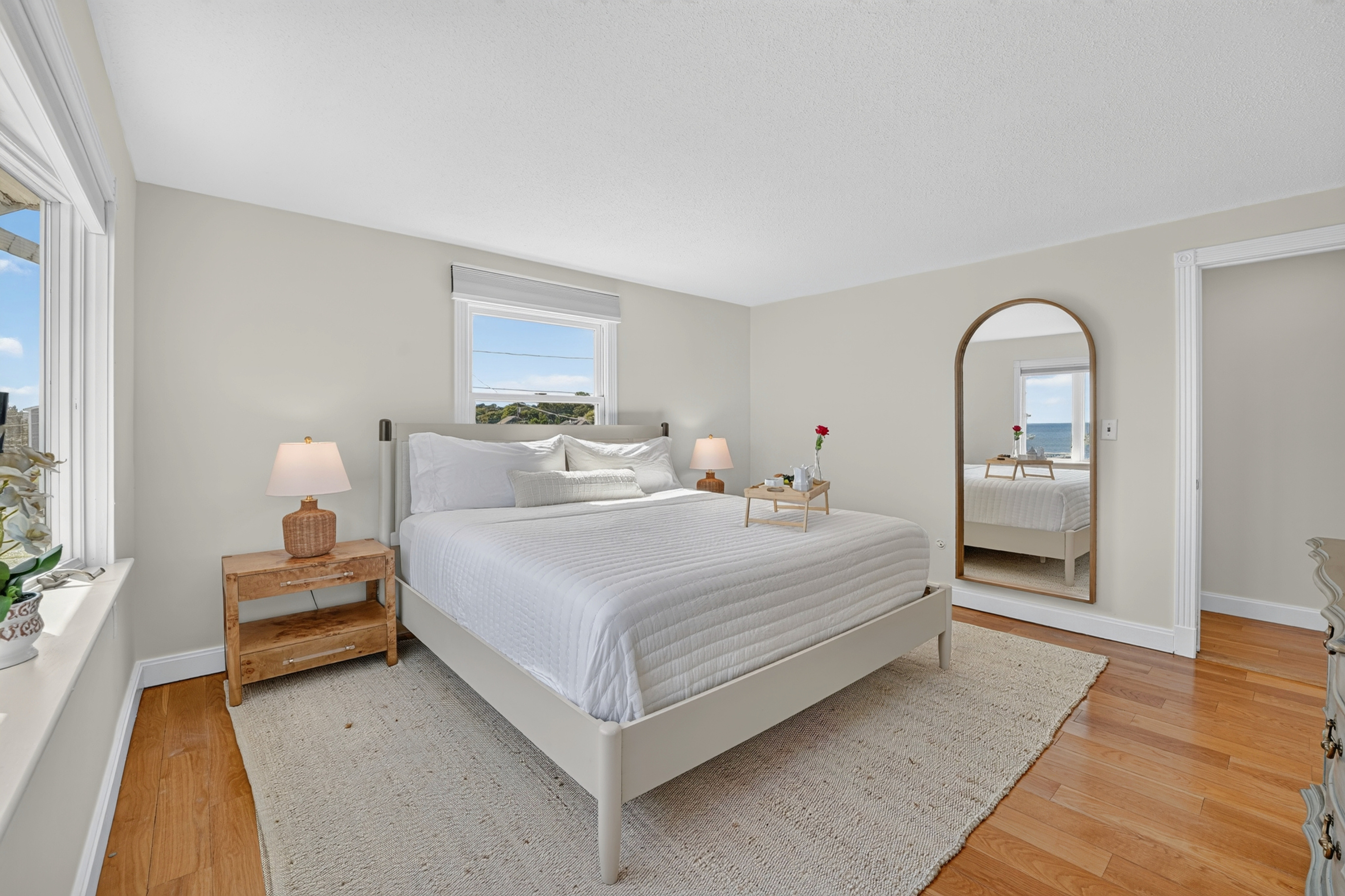 Bright and spacious bedroom designed for restful nights after days spent by the water.