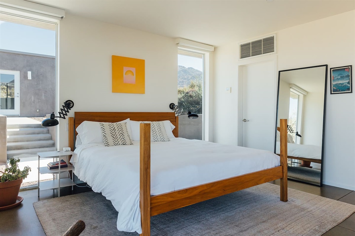 The master bedroom includes a full-length mirror and spacious closet for comfort and convenience during your stay.