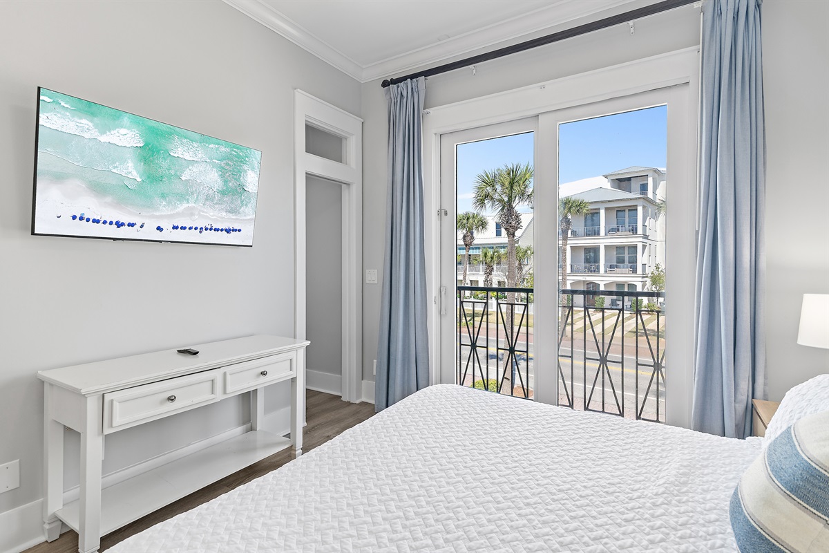 Frangista Sunset's 2nd Floor Bedroom 3: KING bed, full bathroom in hall with walk in shower, balcony overlooking Frangista Beach neighborhood, Smart TV (Sleeps 2)