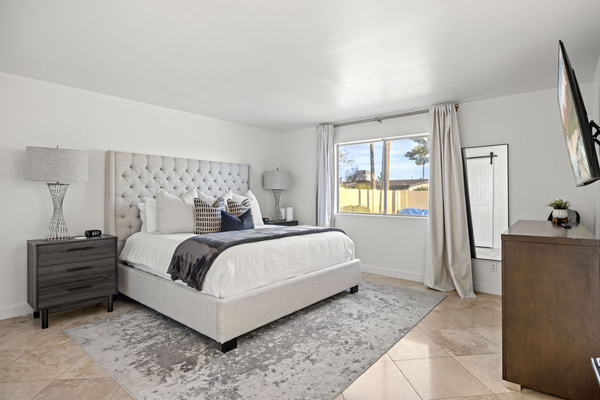 Comfortable and spacious bedroom with natural light and thoughtful design