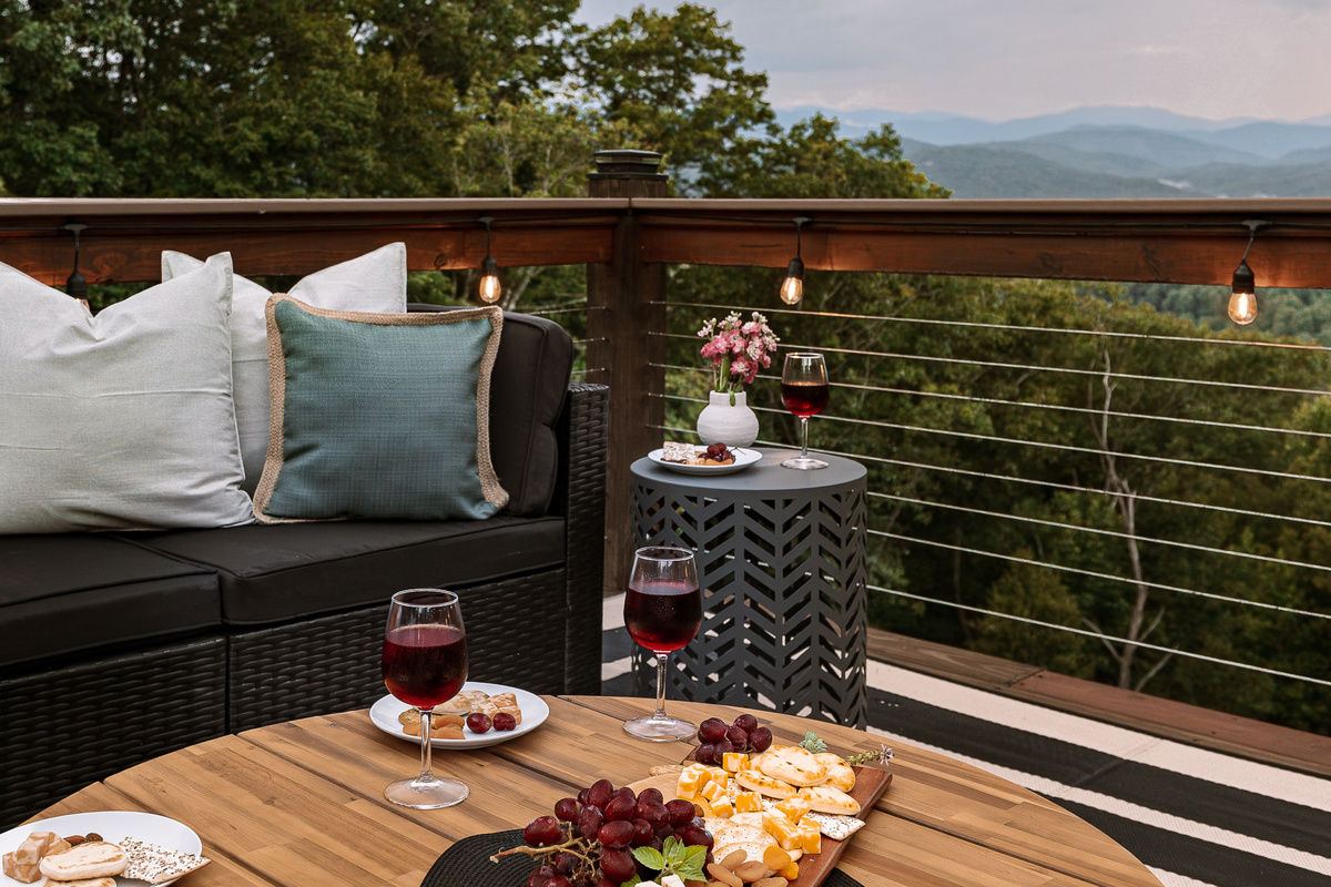 {Mountain View Deck} Pour the wine, put out a snack board, and settle in for sunset with layered Blue Ridge Mountain views beyond the deck.