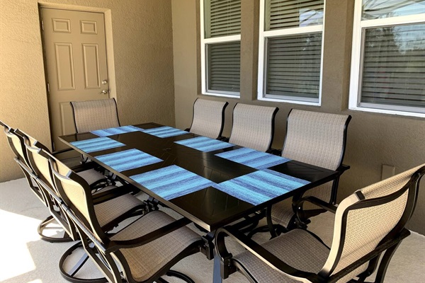 Outdoor seating area with 8 rocking swivel chairs. 
