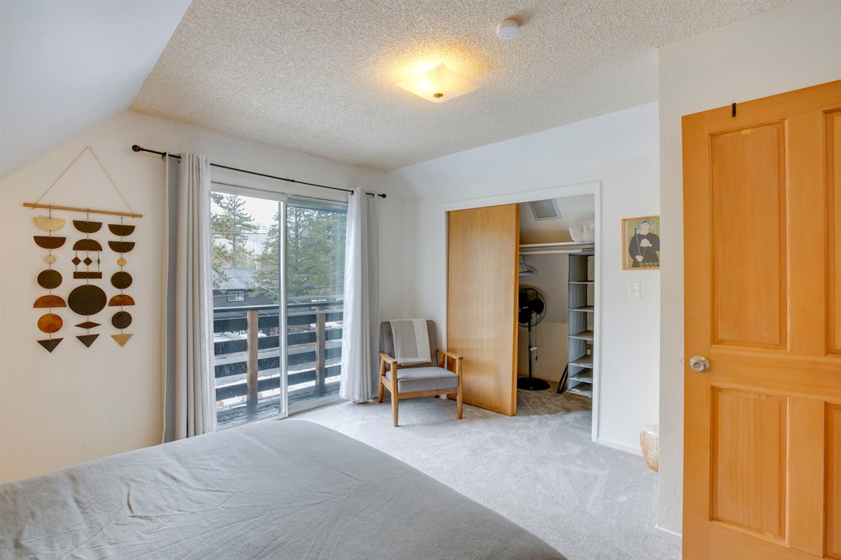 Balcony, closet storage and a tower fan
