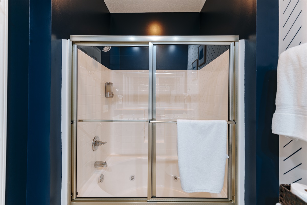 [MasterBath] Indulge in the luxury of our master bath featuring a shower and jacuzzi tub combo. Perfect for relaxation and rejuvenation. 