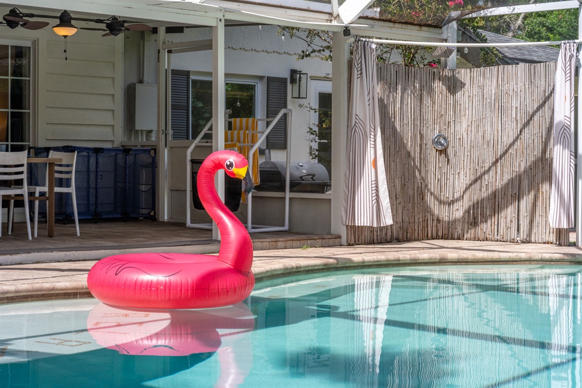 The centerpiece of the area is a large, crystal-clear pool, ideal for cooling off during hot days or enjoying a morning swim.
