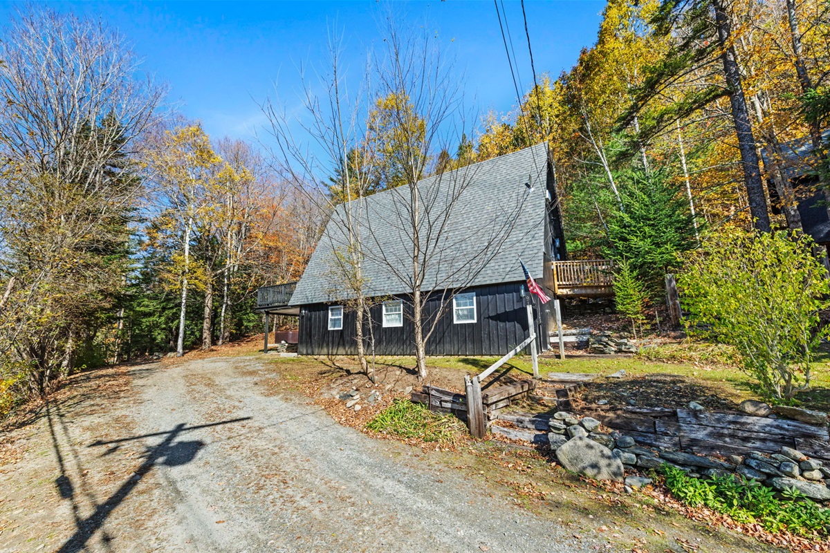 View of the home as seen from the street with arriving. 