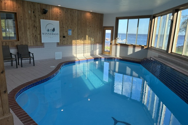 Pool photo with lakeview and Winnebago Shores Villa sign