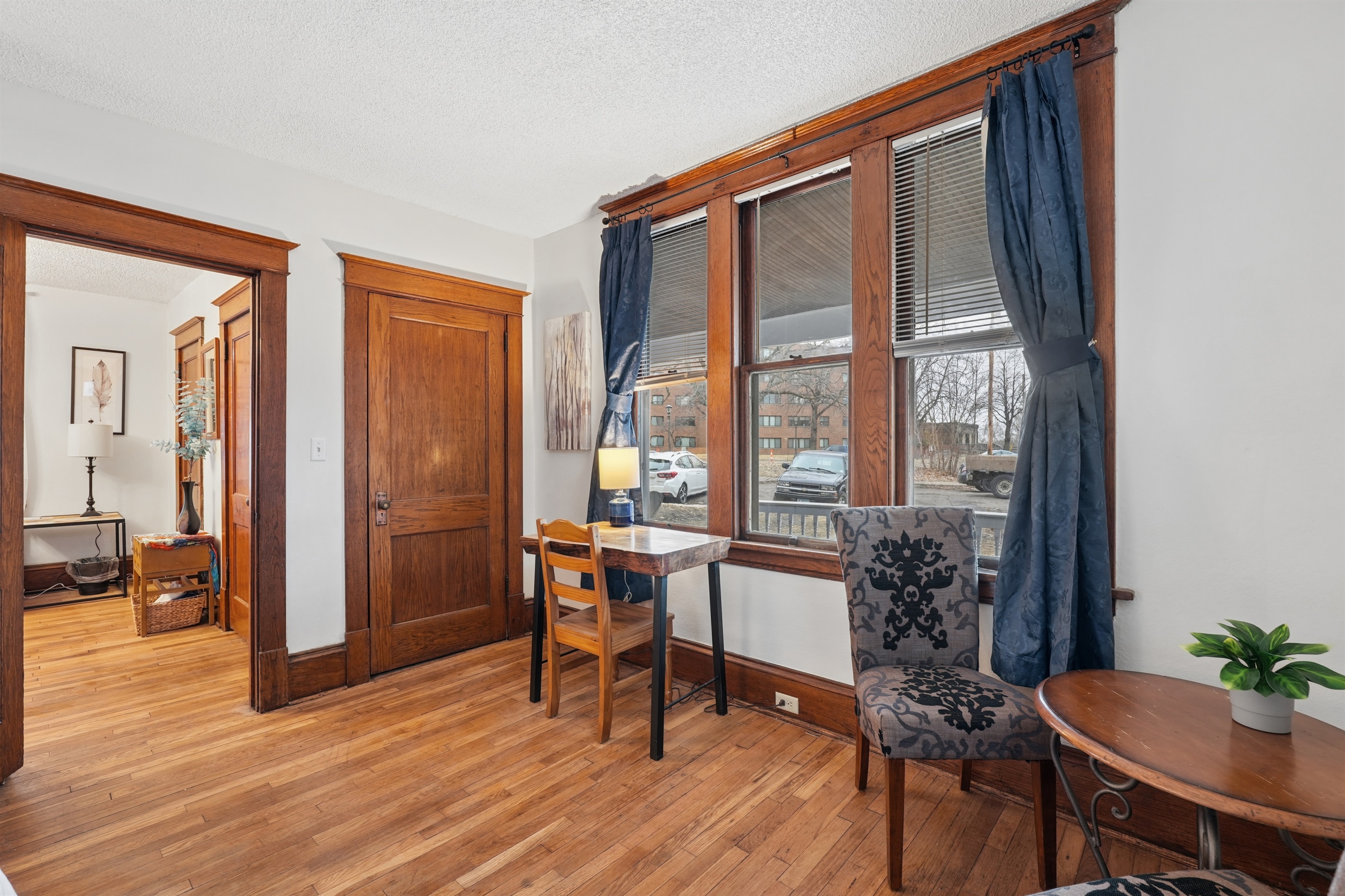 The king bedroom offers a live-edge wooden desk and cozy seating nook for two.