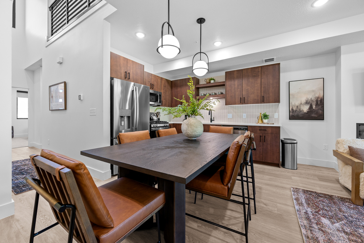 Modern kitchen with dining table seating and easy access to the living area.