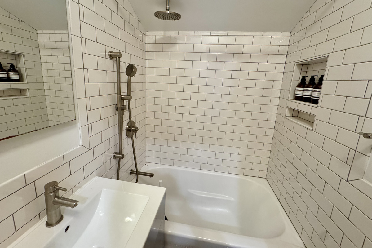 Modern full bathroom with subway tile shower