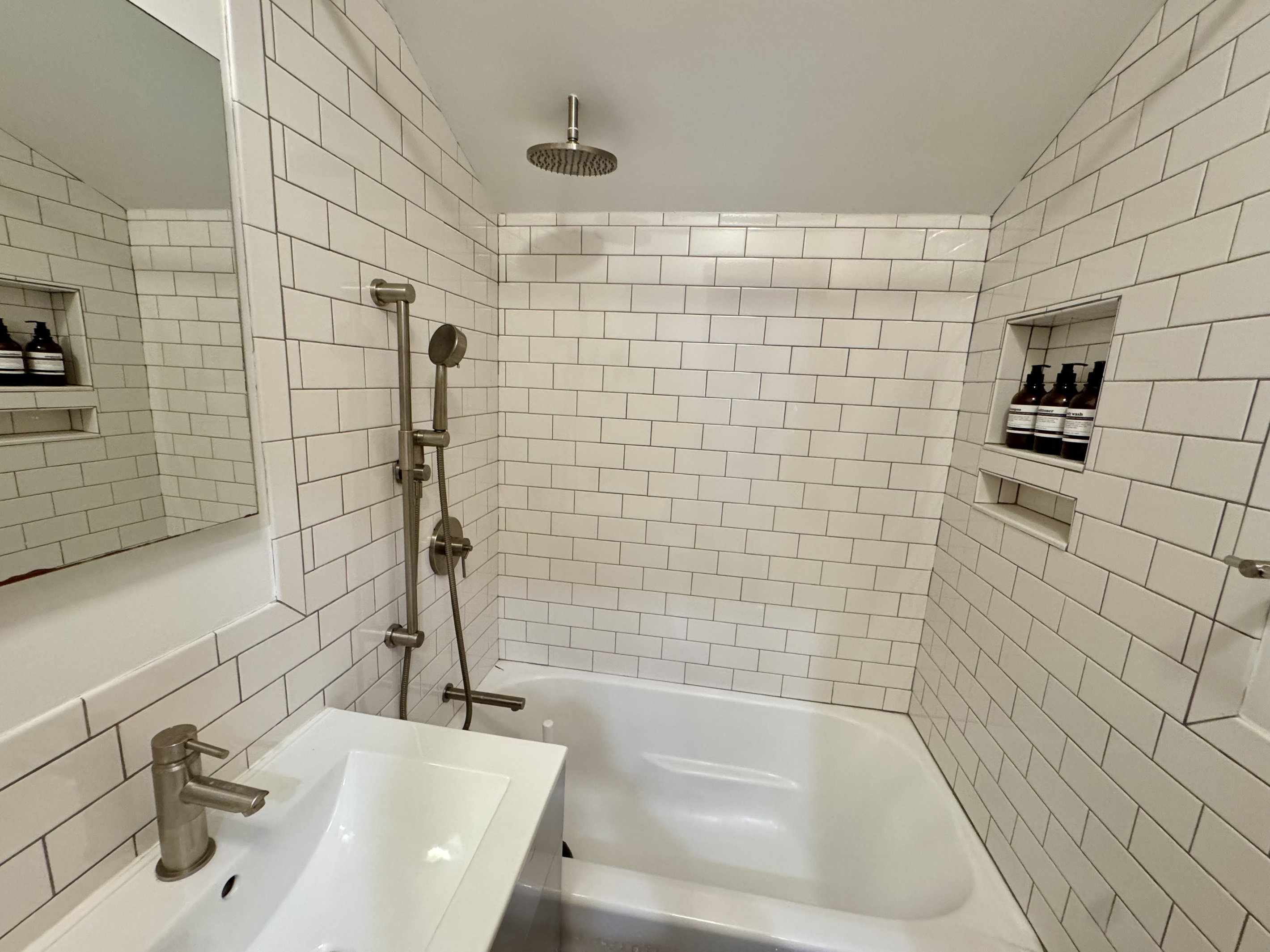 Modern full bathroom with subway tile shower