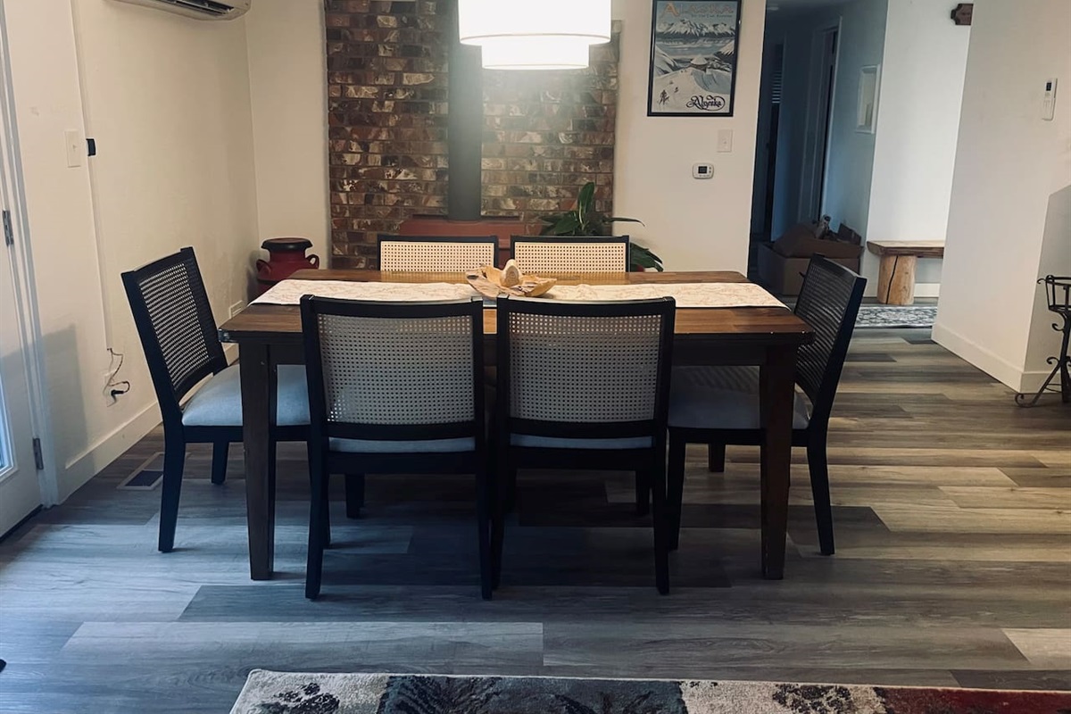 A table for six invites shared moments, where light and space come together to frame conversation and connection.