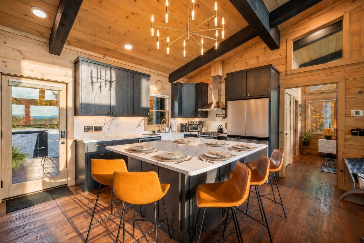 This sleek, modern kitchen with a large island is ideal for hosting and enjoying time with family and friends.