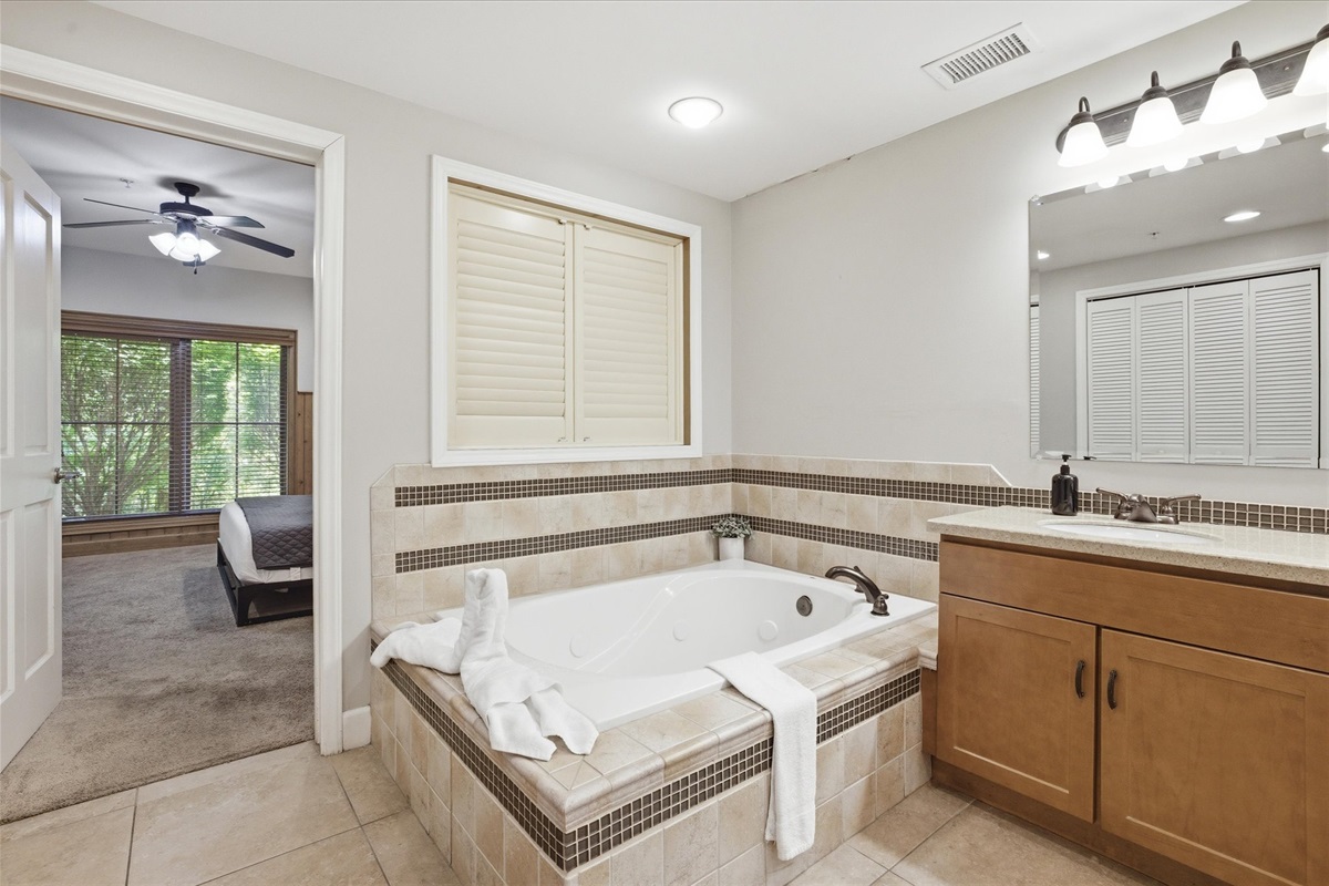Soak, refresh, and take your time in unit 312's master bathroom with a deep soaking tub (featured in each unit in building 300!), double sinks, and a walk-in shower—plenty of space to unwind and get ready without feeling rushed.