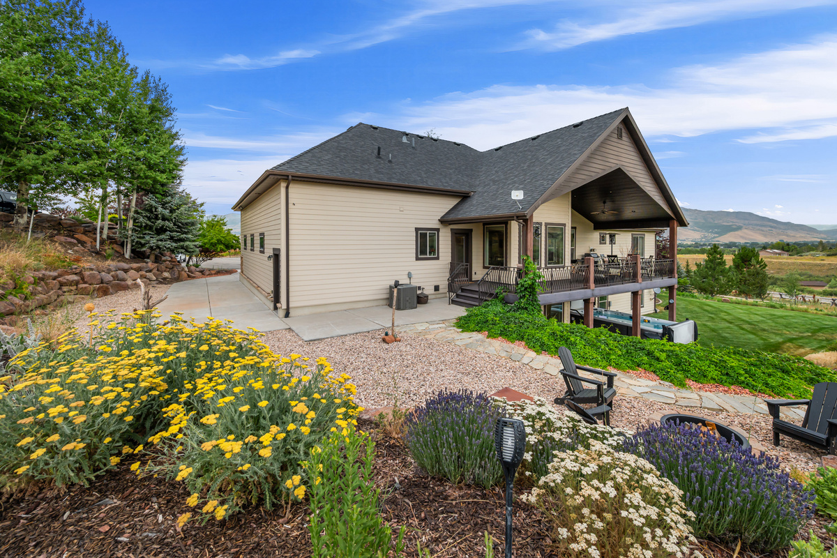 Beautifully landscaped grounds and multiple outdoor living spaces create the perfect setting for relaxing, entertaining, and taking in the mountain scenery.