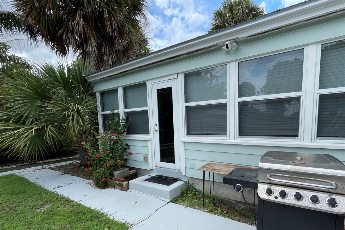 Just off the "Florida Room" is the back patio, featuring a grill, lap pool and seating area.