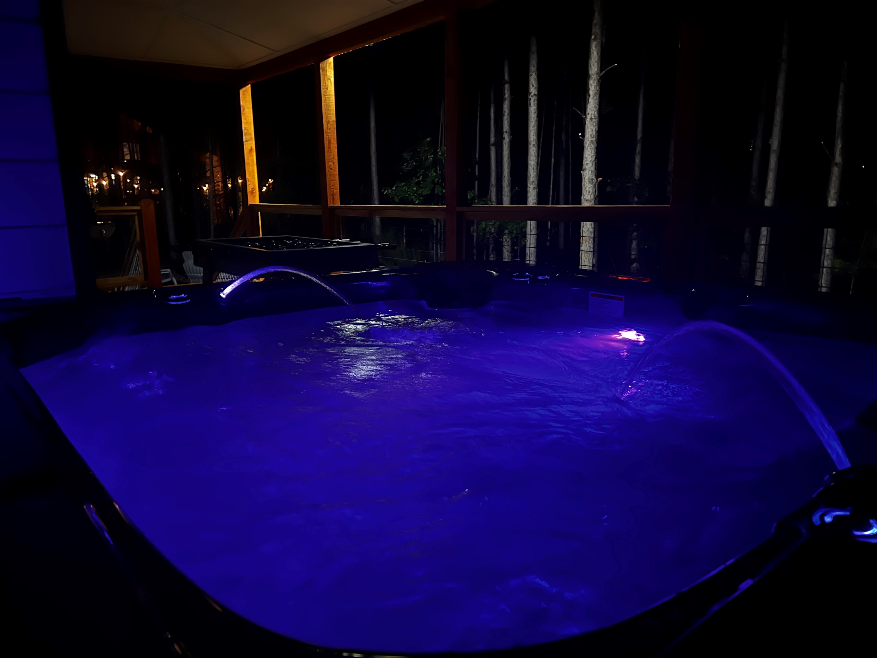 Relax in the bubbly hot tub located at the back of the deck. 