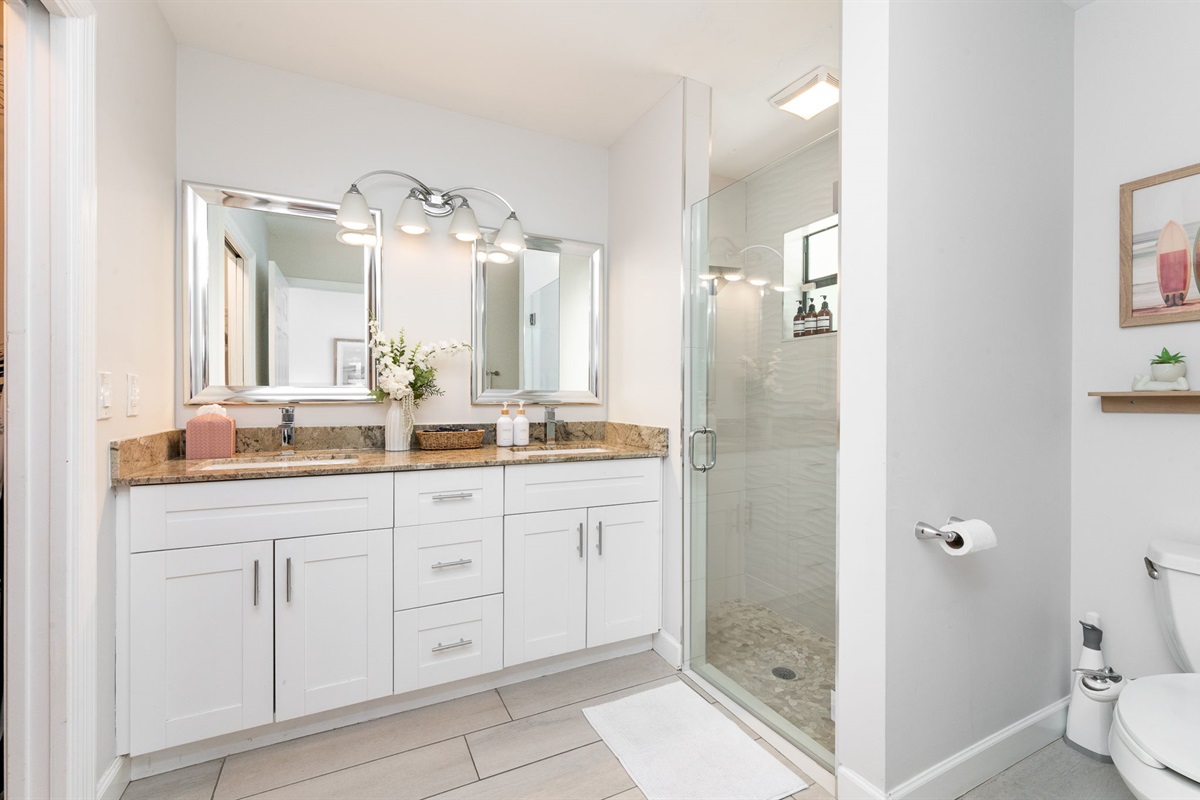 Master bathroom equipped with double sinks to accommodate busy mornings with ease.
