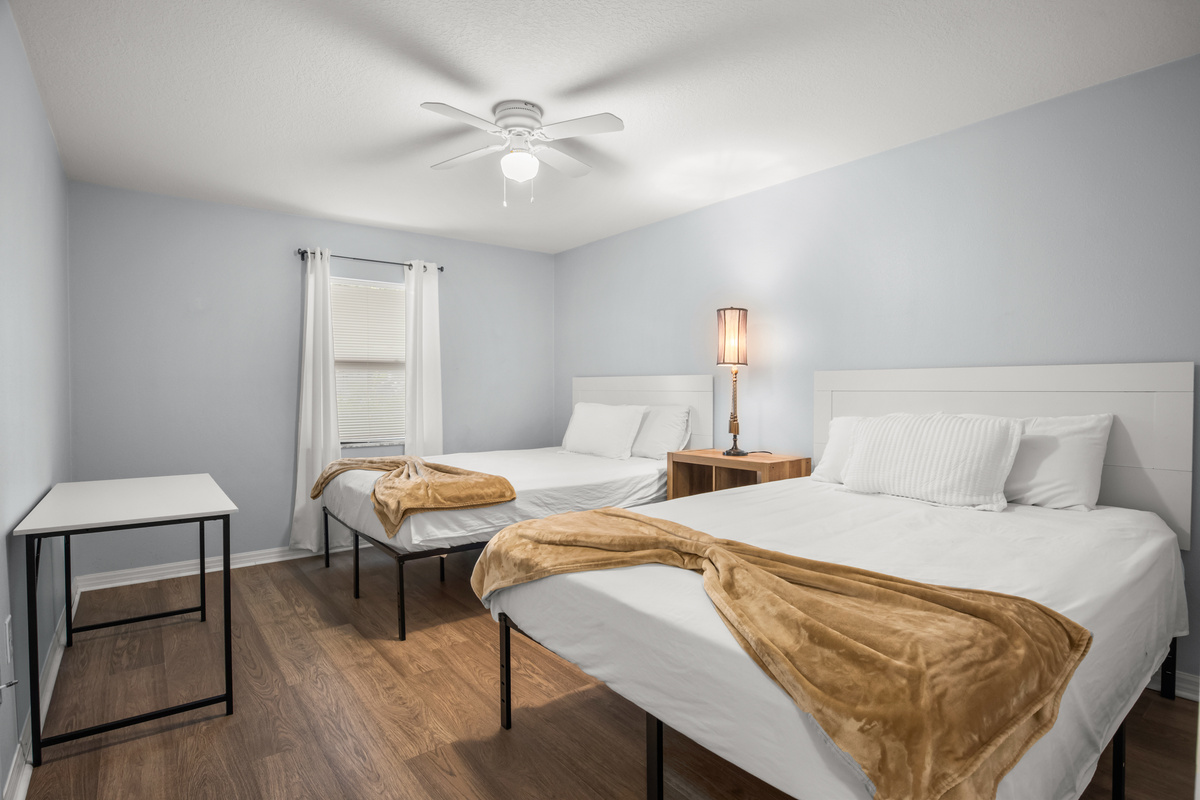 Unit #1 Left: Bedroom #2 features two queen size beds.