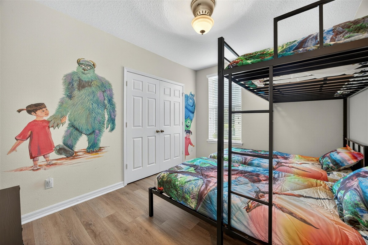 Kids’ bedroom with fun themed décor and twin-over-twin bunk beds.