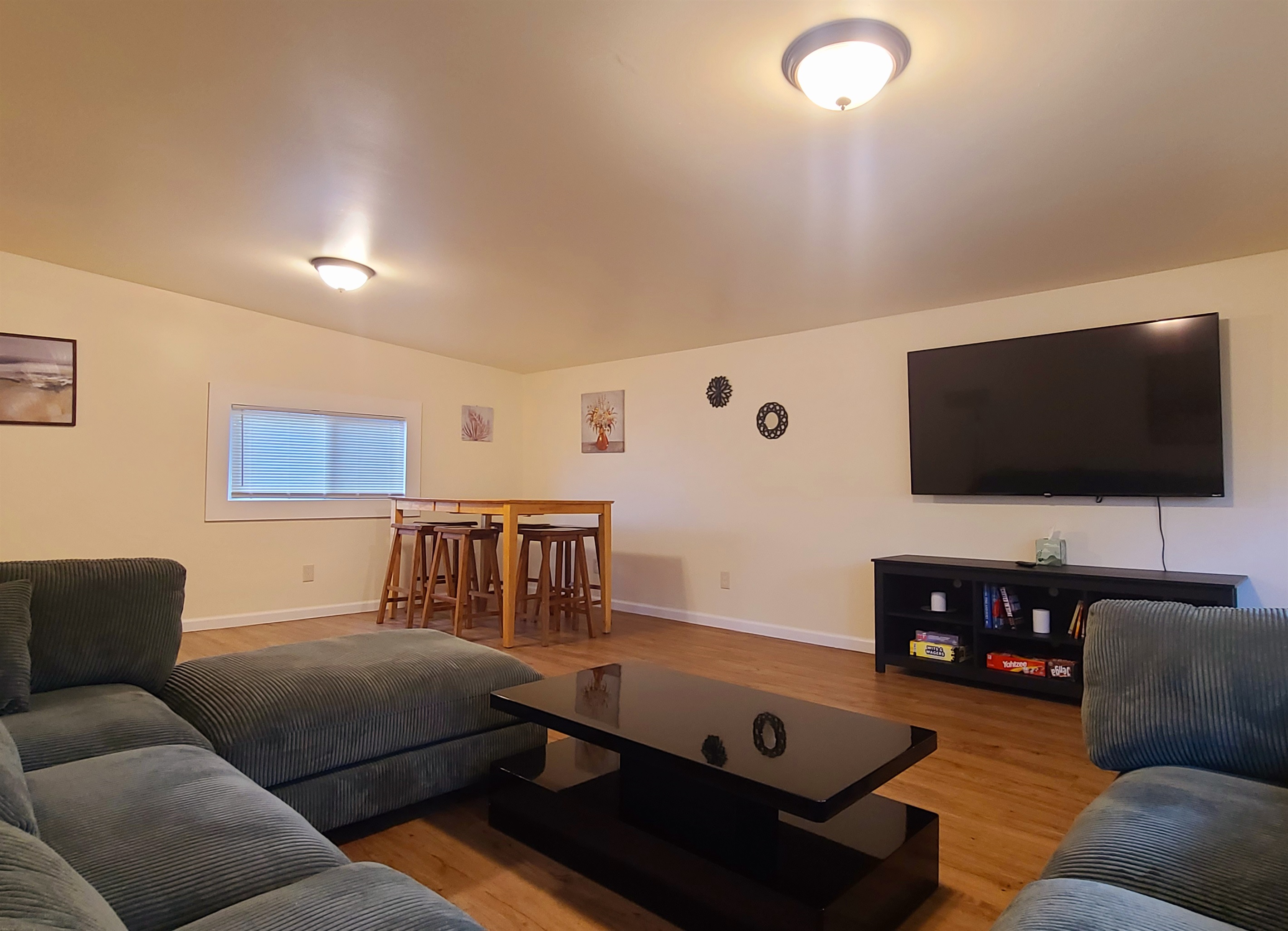 Large sectional in living room w/ dining area and SmartTV