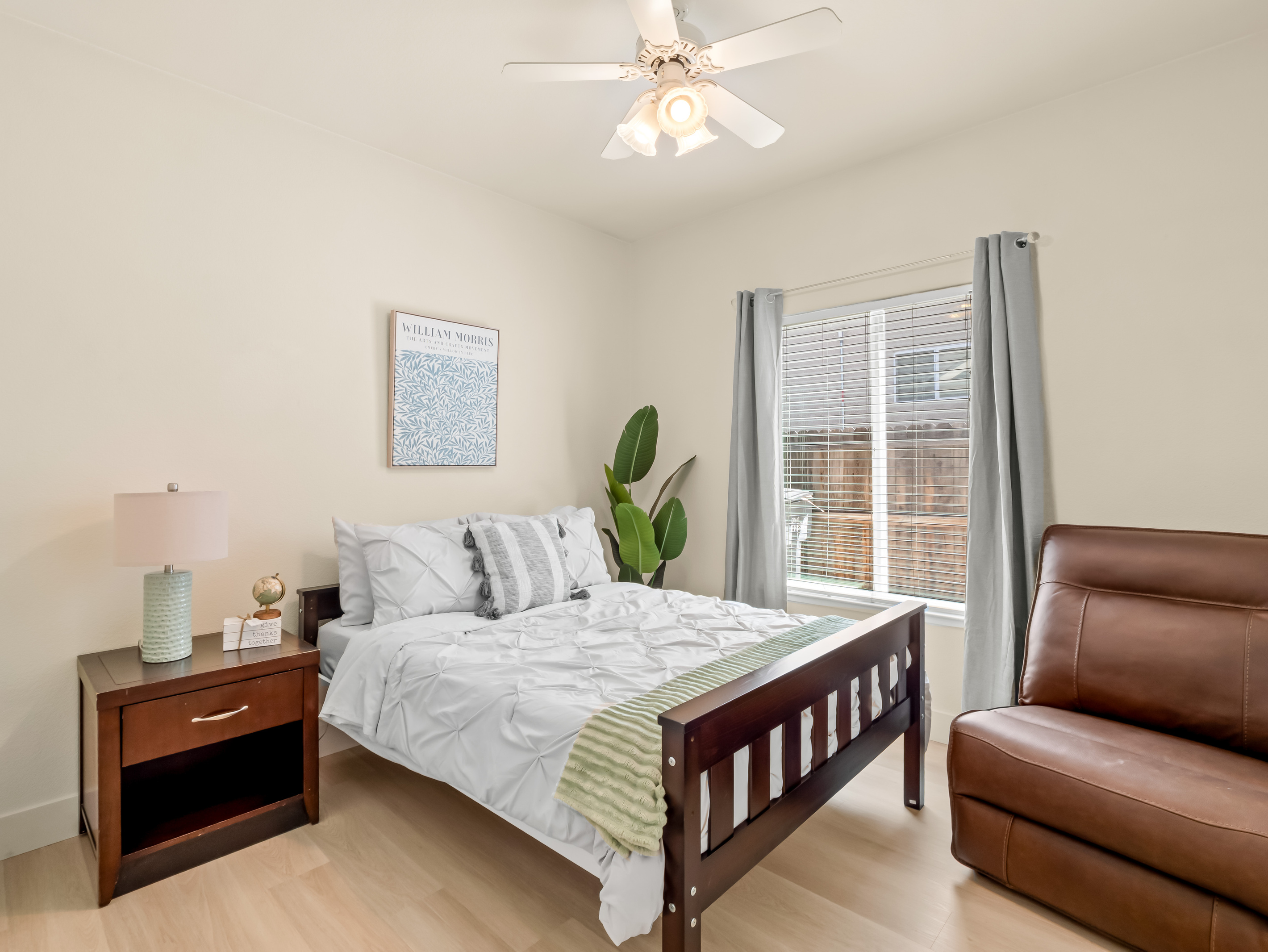 Recharge in this peaceful and comfortable bedroom featuring a cozy bed, soft bedding, and thoughtful touches throughout. Natural light and calming décor create the perfect environment for a restful night's sleep.