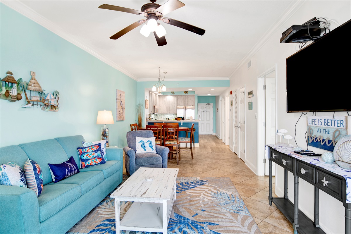 Living room sleeper sofa, 2 end tables, coffee table 2 arm chairs, ceiling fan and a 55" wall mounted Smart TV and a great direct Gulf view