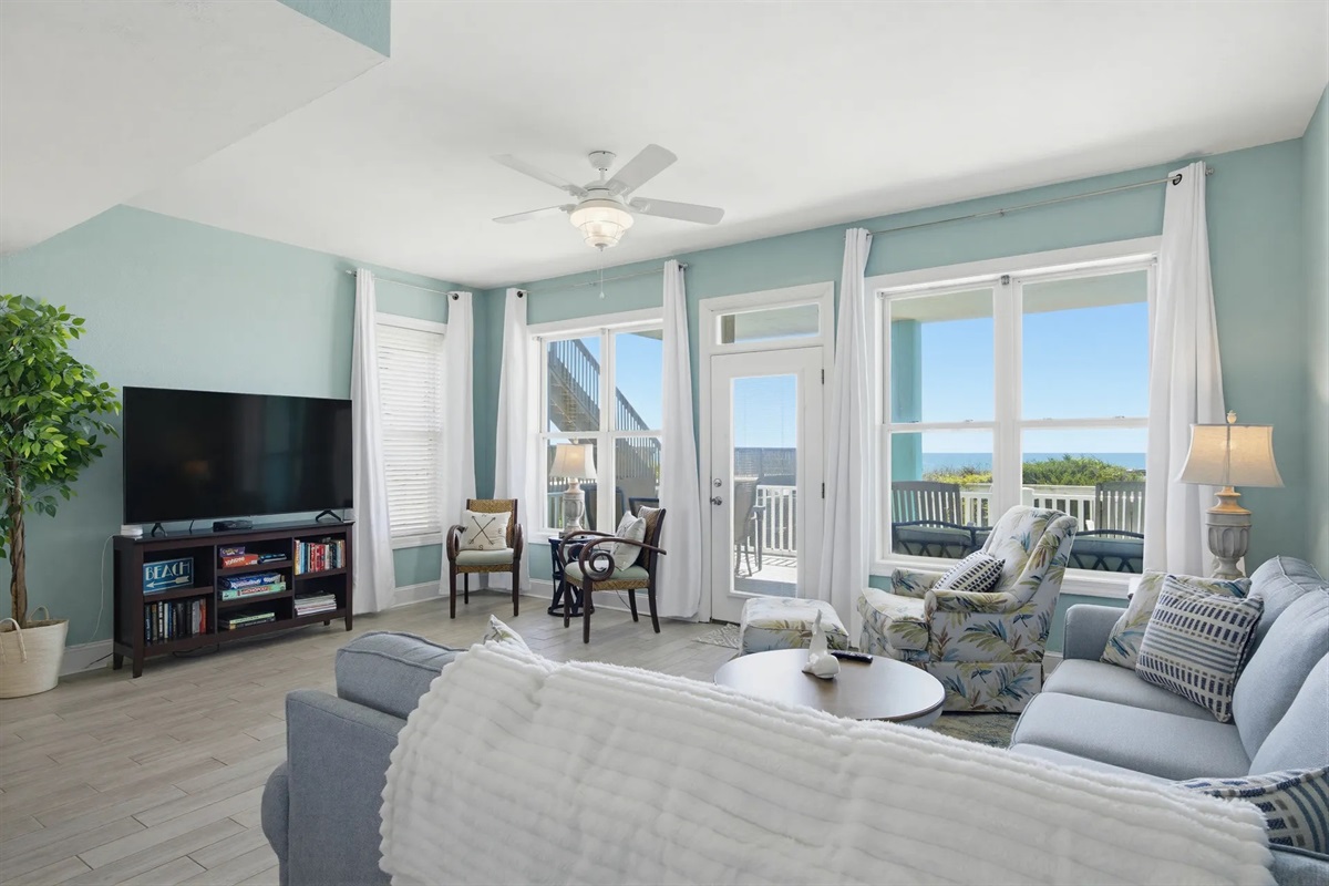 Login to your favorite streaming apps on the 60" smart TV in the oceanfront living room