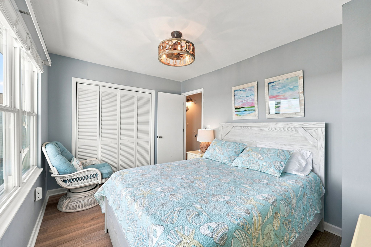 Unwind in the comfortable swivel armchair by the window or drift off to sleep in this peaceful seaside suite.