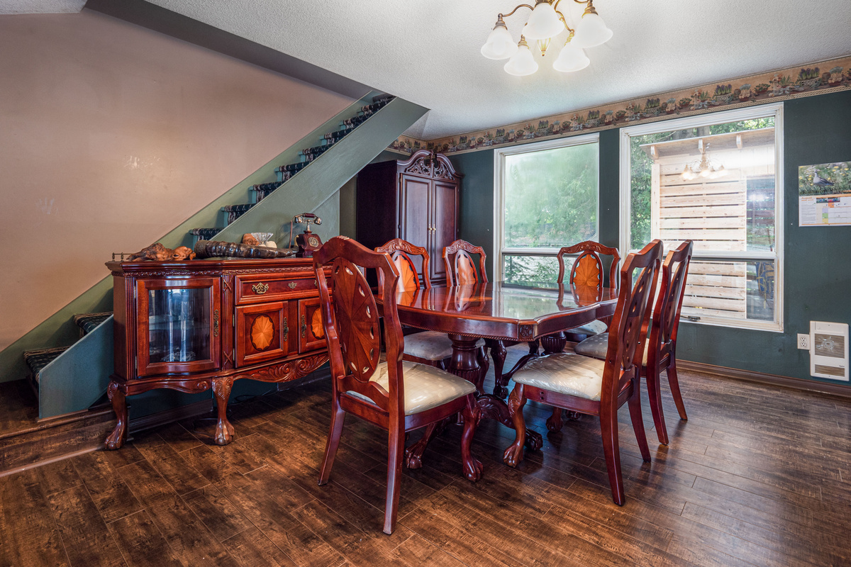 Dining area with large table and warm cottage interior