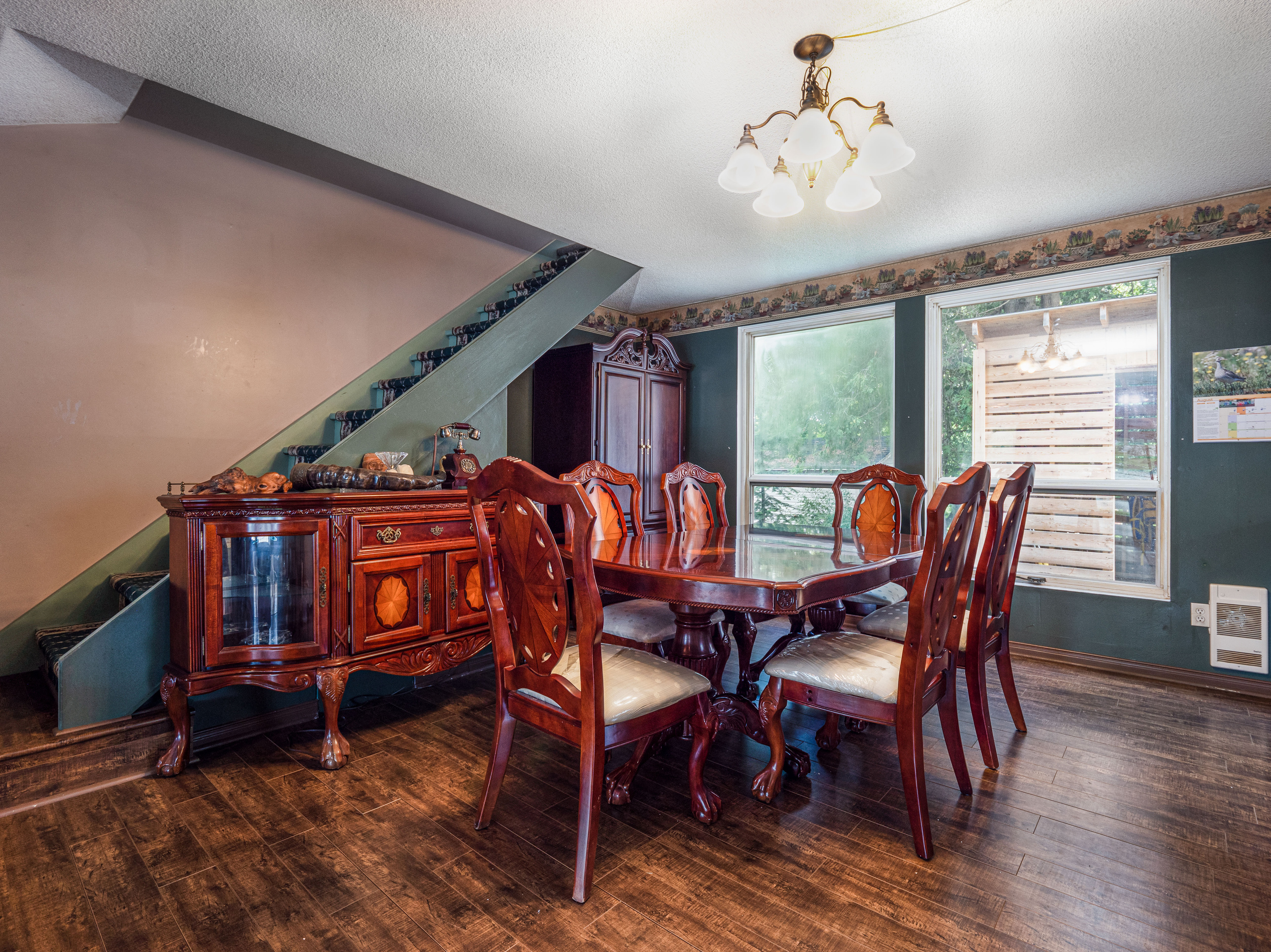 Dining area with large table and warm cottage interior