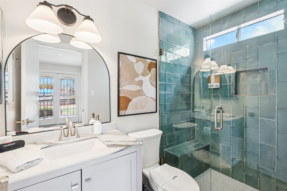 The primary bedroom has a beautiful ensuite bathroom with high-end finishes