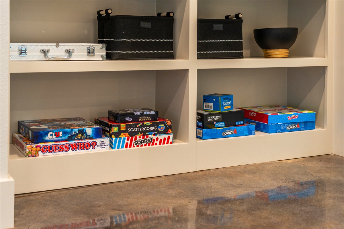 A fully stocked game shelf awaits for family game nights or cozy indoor activities &ndash; ideal for quality time together.