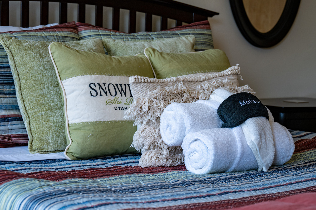 Relax and recharge with plush bedding, fresh linens, and charming mountain-inspired details.