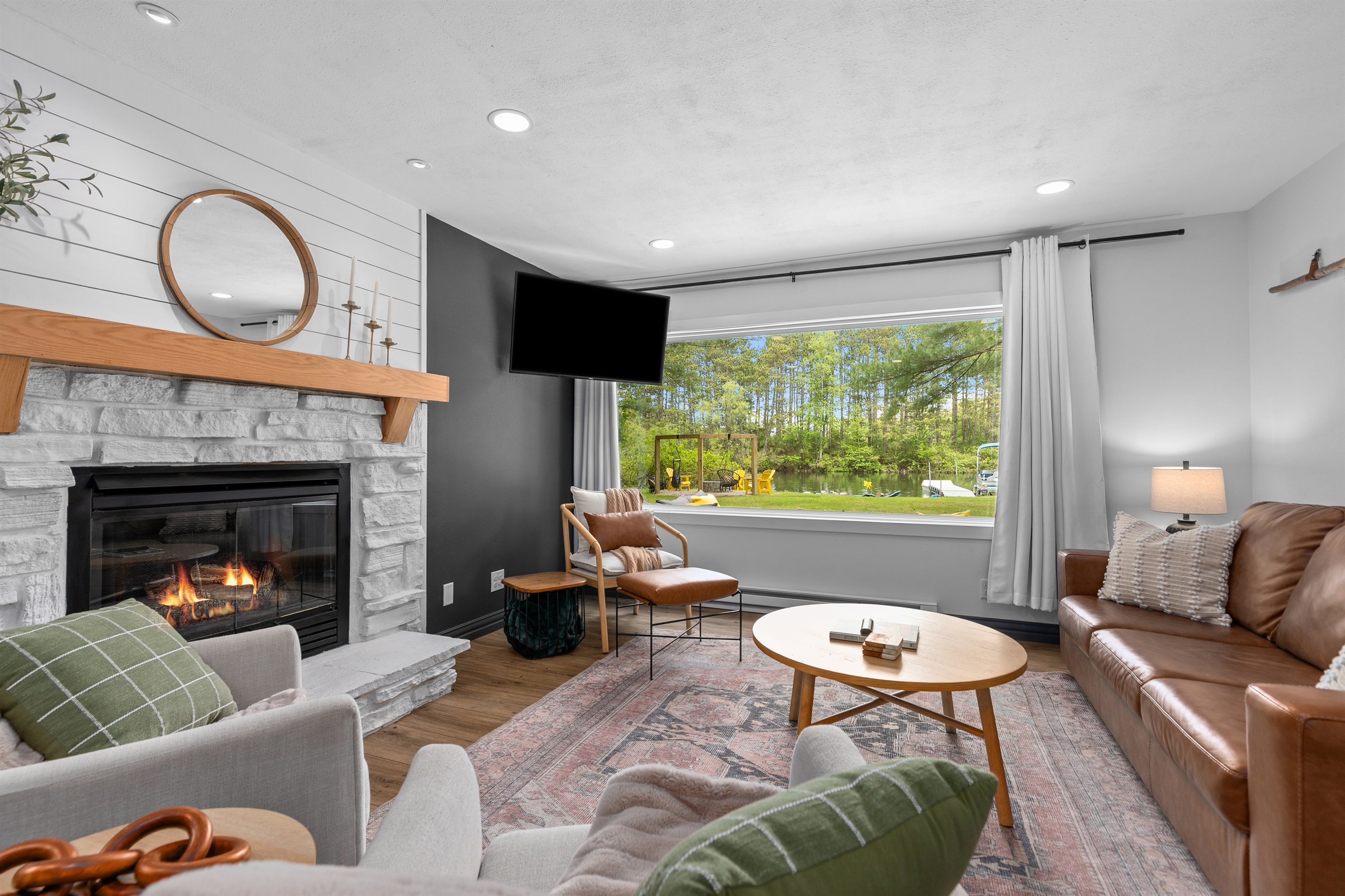 Large windows bring the beauty of the outdoors in, creating a bright and relaxing space.