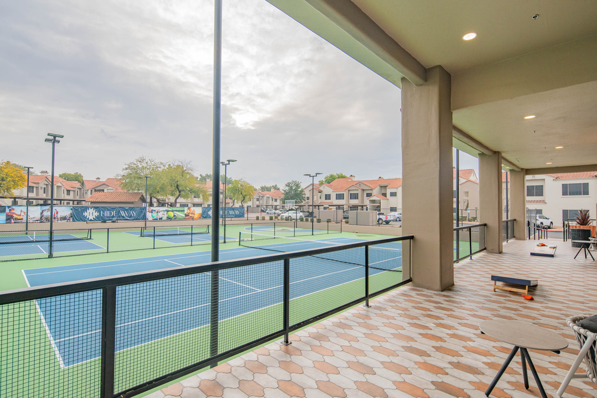 Lounge and cool off by the tennis courts
