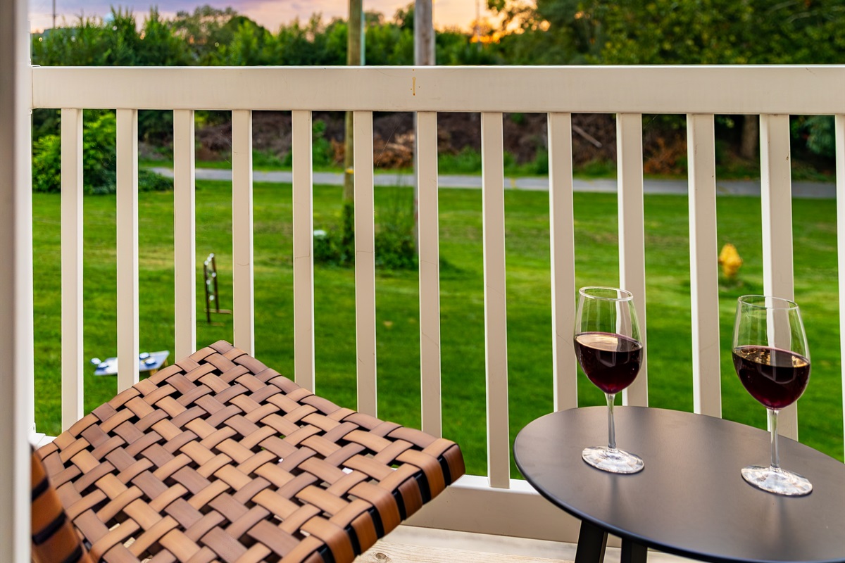 Grab a drink and catch the sunset on the 2nd floor balcony for two
