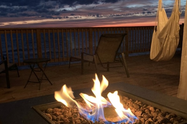 Enjoy relaxing on the deck by the firepit