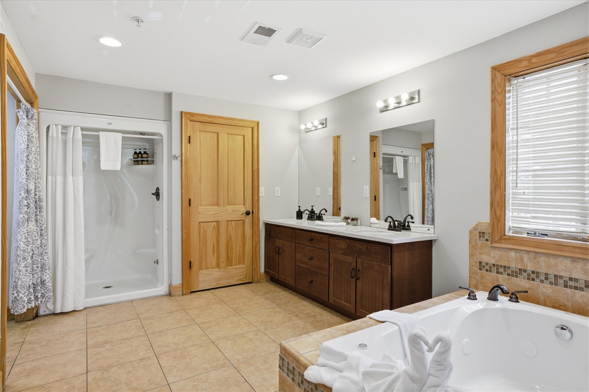The fully-stocked and ready master bath offers a calm, elevated feel with plenty of room to settle in, making everyday routines feel easy and unhurried.